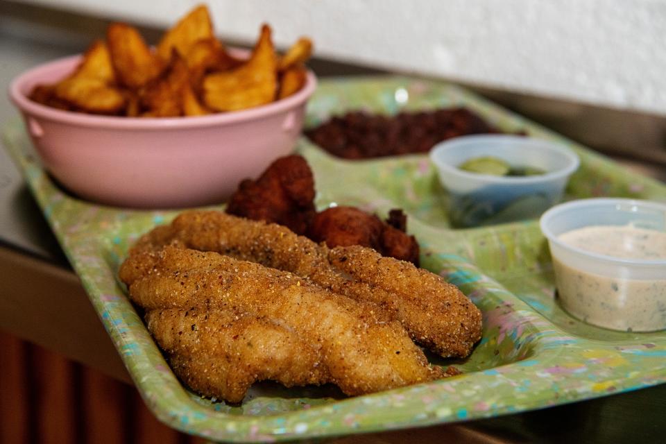 The catfish plate with fries, hushpuppies and Sea Island red peas at Good Hot Fish.