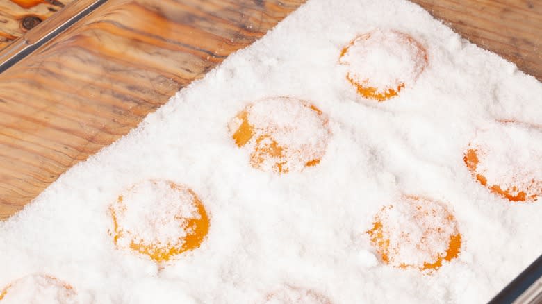 cured egg yolks covered in salt