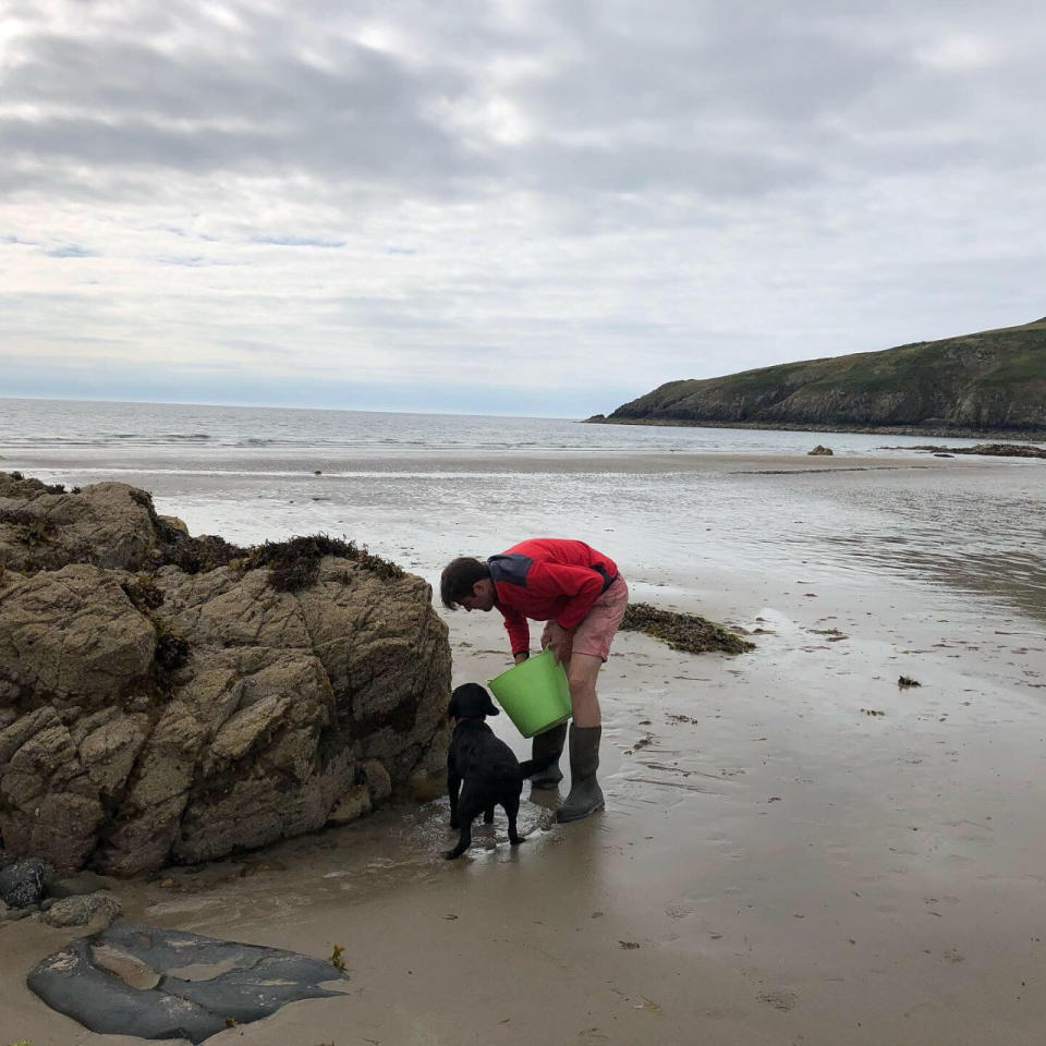 Jim Parums foraging on the beach. (Jim Parums/SWNS)