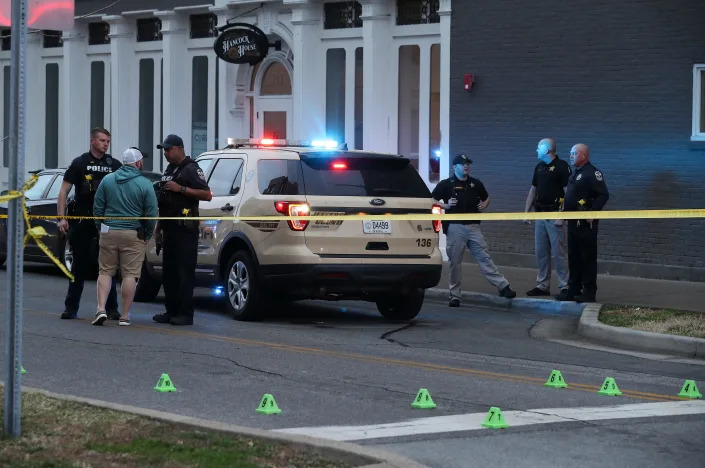 The LMPD investigate the scene where four people were shot at the Seafood Lady restaurant in the NuLu district of Louisville, Ky. on Mar. 6, 2022. 