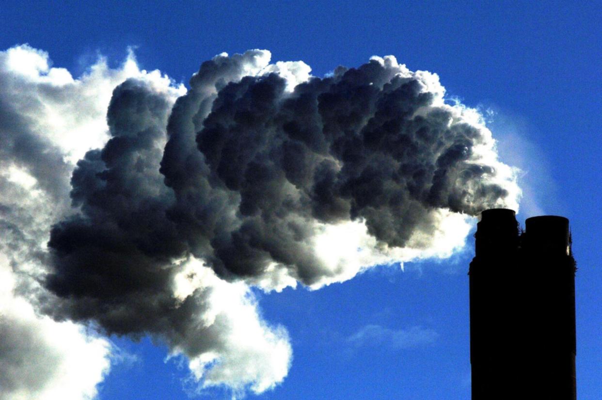 Smoke billows into the air from a coal fired power plant. The UK has committed to bringing greenhouse gases to zero by 2050 (John Giles/PA)