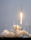 A rocket carrying the SpaceX Dragon ship lifts off from launch complex 40 at the Cape Canaveral Air Force Station in Cape Canaveral, Fla., Friday, April 18, 2014. The rocket will deliver research equipment, food and other supplies to the International Space Station. (AP Photo/John Raoux)