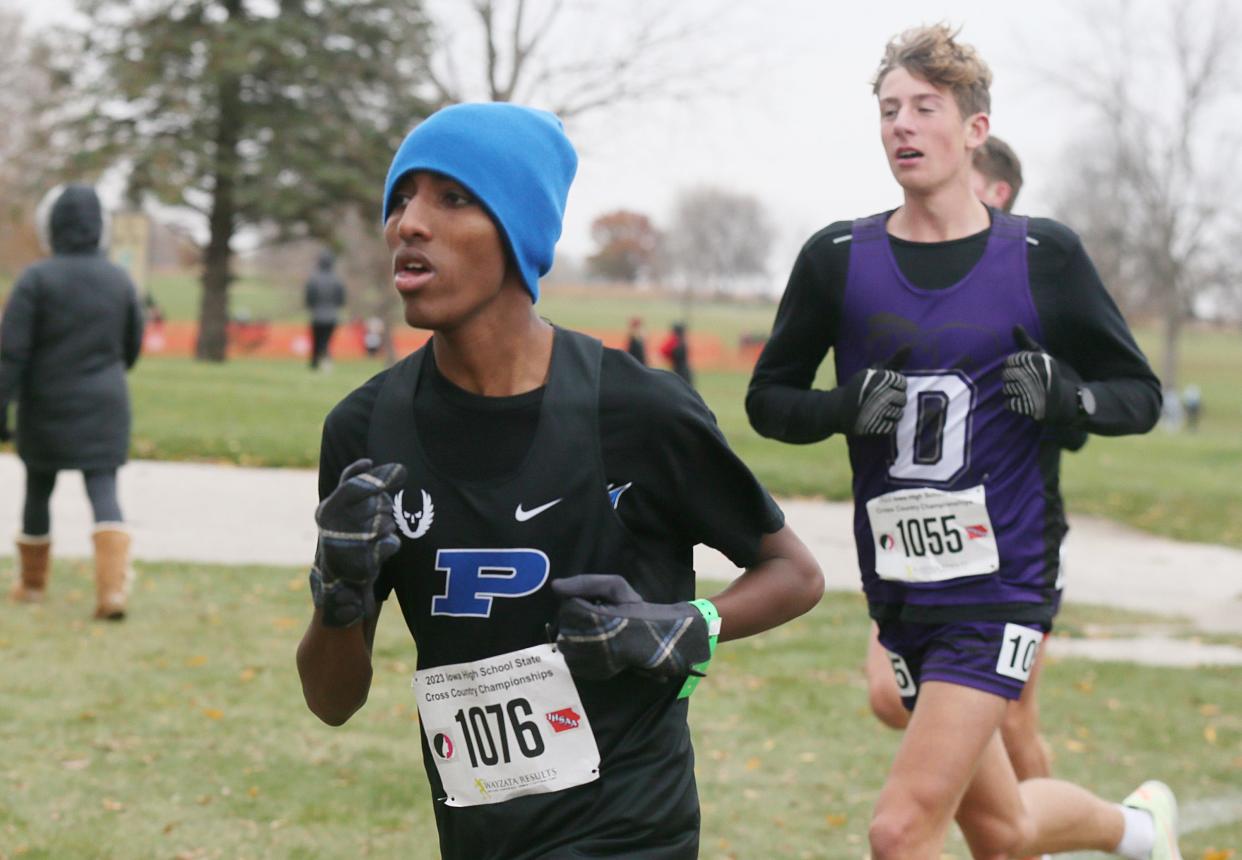 Perry's Yonas Andemichael runs during the Class 3A boys race in the High School Cross Country Championship on Saturday, Oct. 28, 2023, in Fort Dodge.