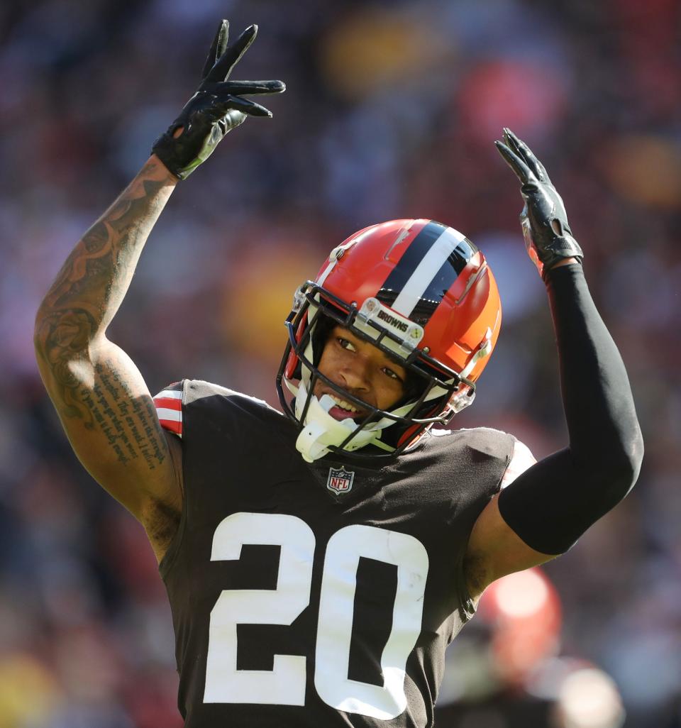 Cleveland Browns cornerback Greg Newsome II (20) gets the crowd pumped up on third down during the first half of an NFL football game against the Pittsburgh Steelers, Sunday, Oct. 31, 2021, in Cleveland, Ohio.