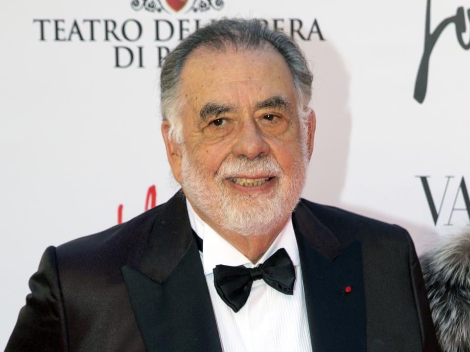 FILE - In this May 22, 2016 file photo, director Francis Ford Coppola poses for photographers as he arrives for the premiere of Verdi's "La Traviata'' at the Rome Opera House, in Rome. Coppola and the cast of "The Godfather" reunited for one evening and a double feature at Radio City Music Hall to celebrate the film's 45th anniversary. The Tribeca Film Festival closed out its 16th edition Saturday, April 29, 2017, with a grand double feature of "The Godfather," parts one and two. (AP Photo/Andrew Medichini, File)