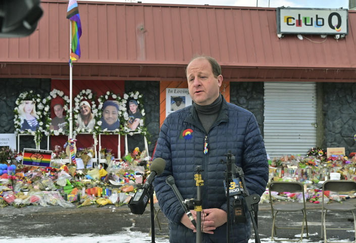 Colorado Gov. Jared Polis speaks in front of a memorial set up outside Club Q in Colorado Springs, Colo., Tuesday, Nov. 29, 2022. Polis, the first openly gay man to be elected governor in the United States, paid tribute to the victims who were killed in last week's mass shooting at the gay nightclub. (Jerilee Bennett/The Gazette via AP)