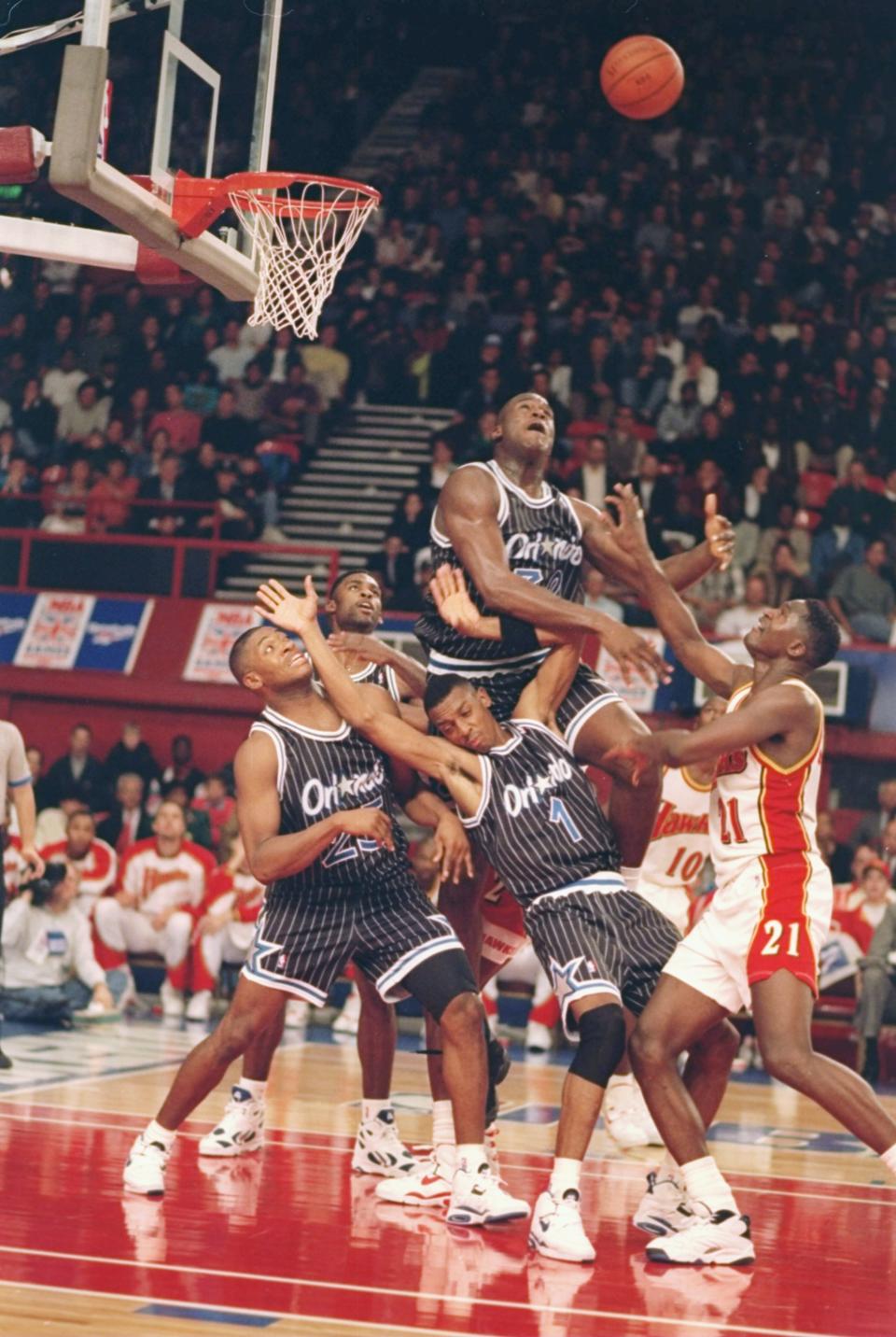 O'Neal leaps up for the ball during a game against the Atlanta Hawks at Wembley Stadium in London, England, October 1993. (Mike Cooper/Allsport)