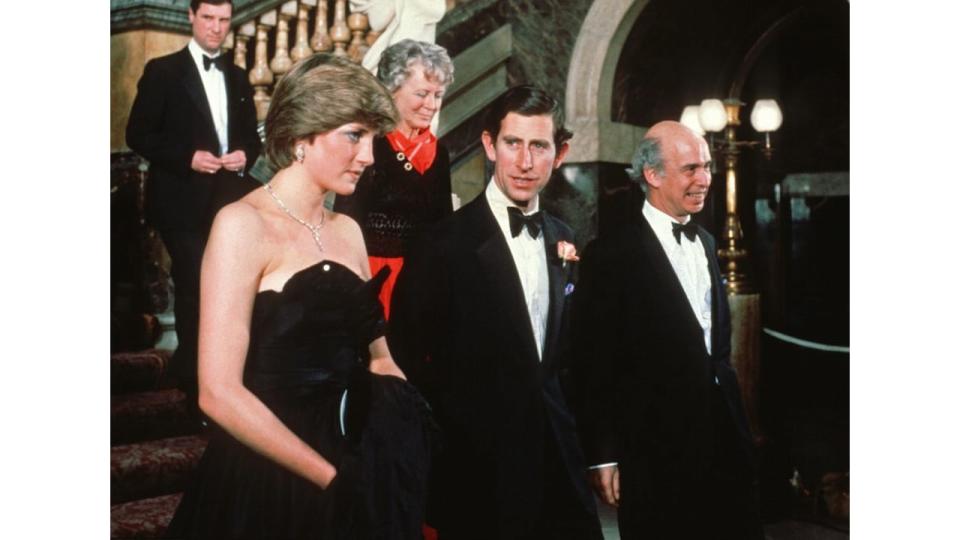  Prince Charles, Prince of Wales and his fiance, Lady Diana Spencer, wearing a strapless black taffeta dress designed by David and Elizabeth Emanuel, attend a fundraising concert and reception at Goldsmiths Hall in aid of The Royal Opera House on March 9, 1981