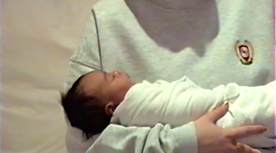 Kylie is handed the baby in the adorable clip. Photo: YouTube/Kylie Jenner