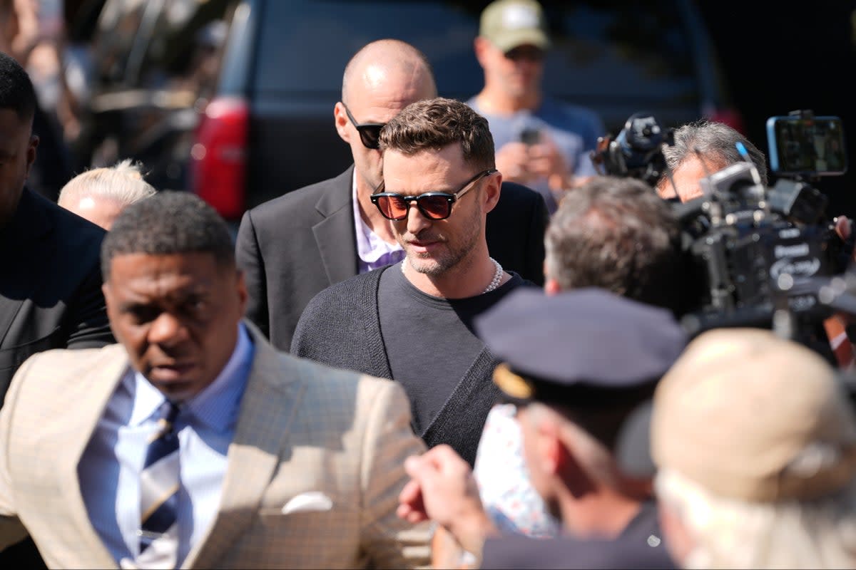 Justin Timberlake was mobbed by fans as he entered Sag Harbor Village Court with a police escort (AP)