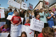 <p>Children join their parents during a protest rally against gun violence in downtown Los Angeles on Monday, Feb. 19, 2018. (Photo: Richard Vogel/AP) </p>