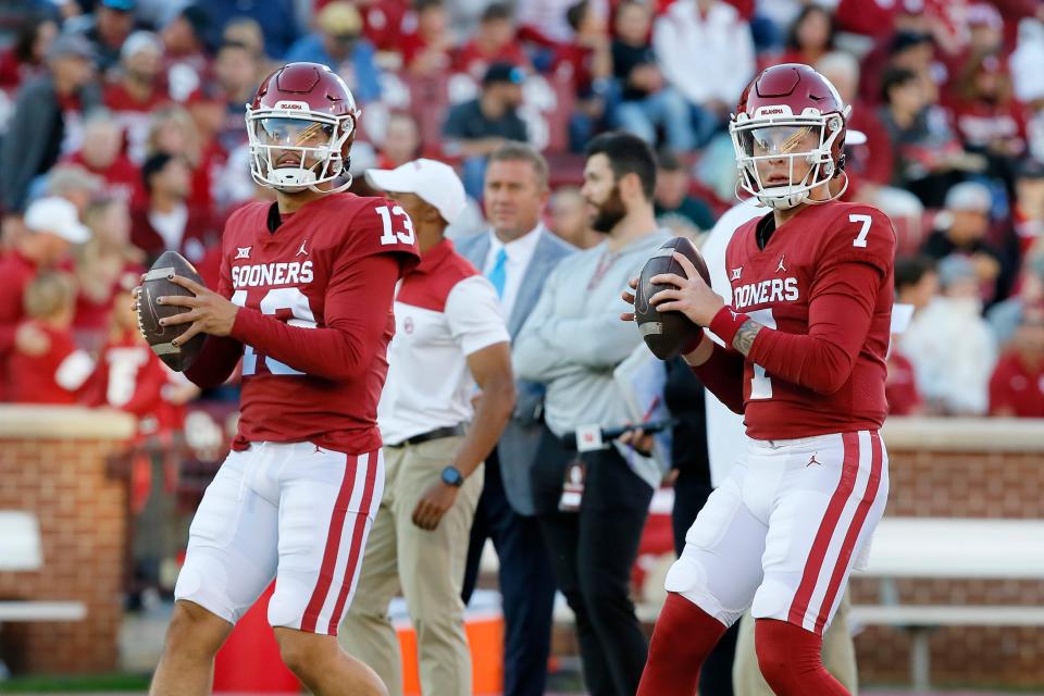 Oklahoma's Oklahoma's Caleb Williams (13) and Spencer Rattler (7) warm up before a college football game between the University of Oklahoma Sooners (OU) and the TCU Horned Frogs at Gaylord Family-Oklahoma Memorial Stadium in Norman, Oklahoma, on Oct. 16, 2021.