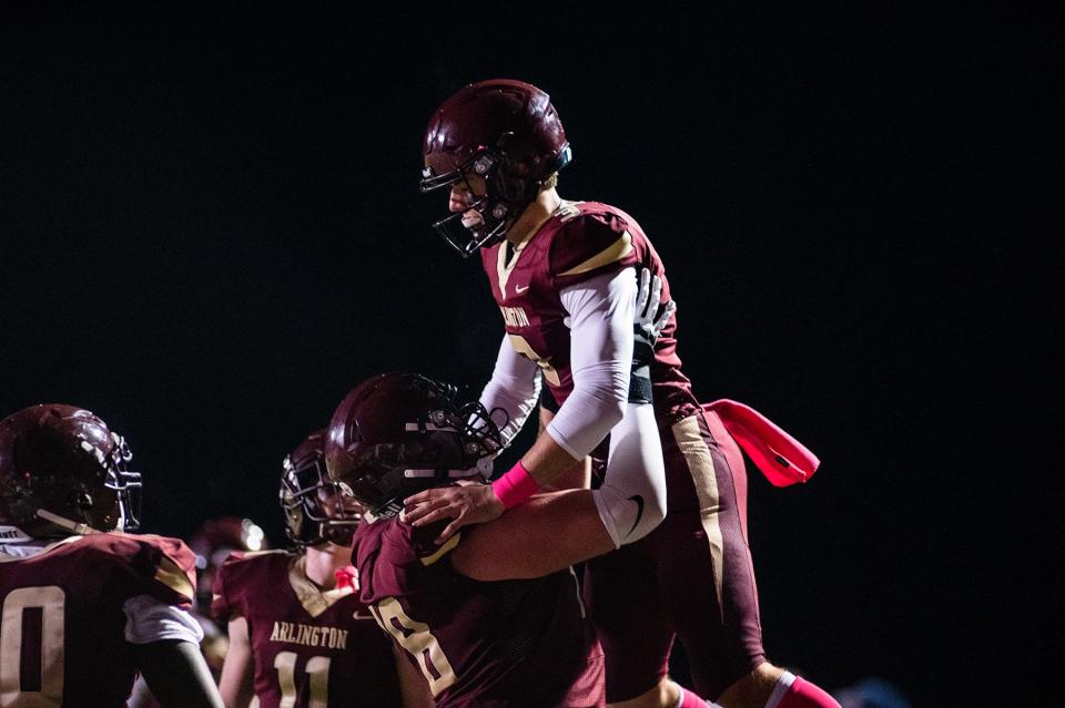 Arlington celebrates a touchdown during the Section 1 class AA quarterfinal football game at Arlington High School in Freedom Plains, NY on Friday, October 28, 2022. Arlington defeated New Rochelle. KELLY MARSH/FOR THE POUGHKEEPSIE JOURNAL