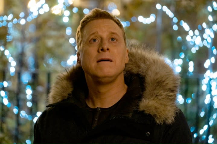 Alan Tudyk looks up and ponders in Resident Alien.