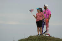 Fans watch from the 15th hole during a Ryder Cup singles match at the Whistling Straits Golf Course Sunday, Sept. 26, 2021, in Sheboygan, Wis. (AP Photo/Charlie Neibergall)