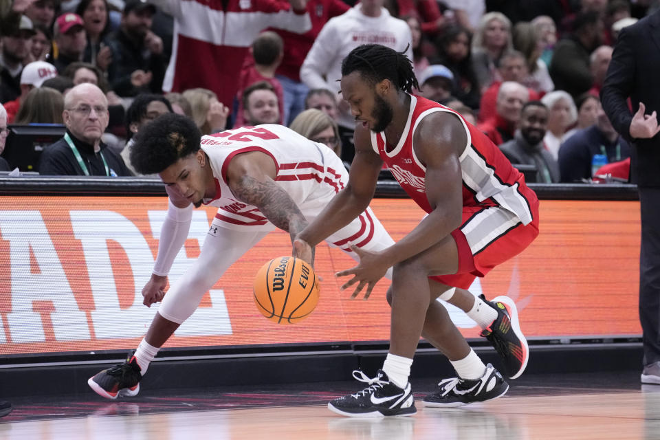 Wisconsin's Chucky Hepburn (23) steals the ball from Ohio State's Bruce Thornton during the second half of an NCAA college basketball game at the Big Ten men's tournament, Wednesday, March 8, 2023, in Chicago. Ohio State won 65-57. (AP Photo/Charles Rex Arbogast)