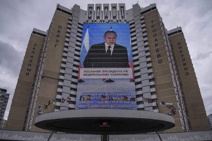 President Vladimir Putin of Russia projected onto the side of building during a speech in Moscow, on April 21, 2021. (Sergey Ponomarev/The New York Times)