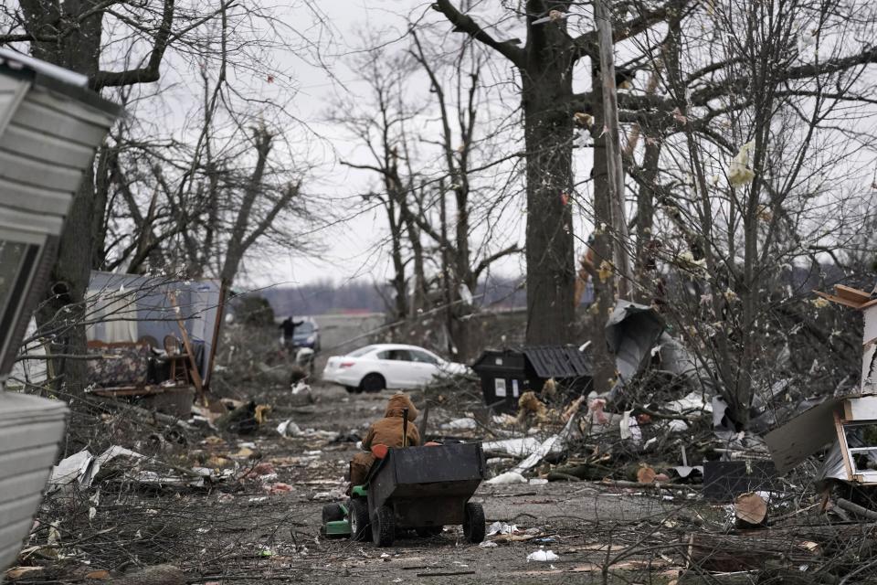 Shawn Hamilton takes items in a wagon to bring to a friends house where he will stay after his mobile home was damaged following a severe storm Friday, March 15, 2024, in Lakeview, Ohio. (AP Photo/Joshua A. Bickel)