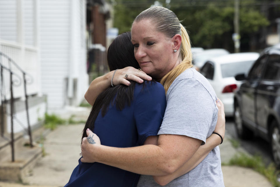 Miltreda Kress hugs her daughter, Brianna Donahue, in front of their home in Philadelphia. (Rachel Wisniewski / for NBC News)
