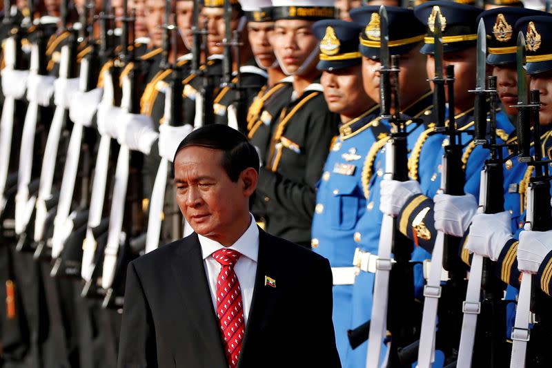 FILE PHOTO: Myanmar's President Win Myint reviews the honor guard during his welcome ceremony at the Government House in Bangkok