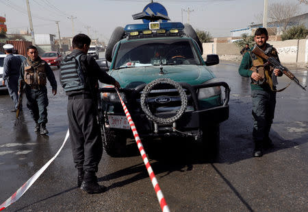 Afghan policemen keep watch at the site of a suicide attack in Kabul, Afghanistan October 29, 2018. REUTERS/Omar Sobhani