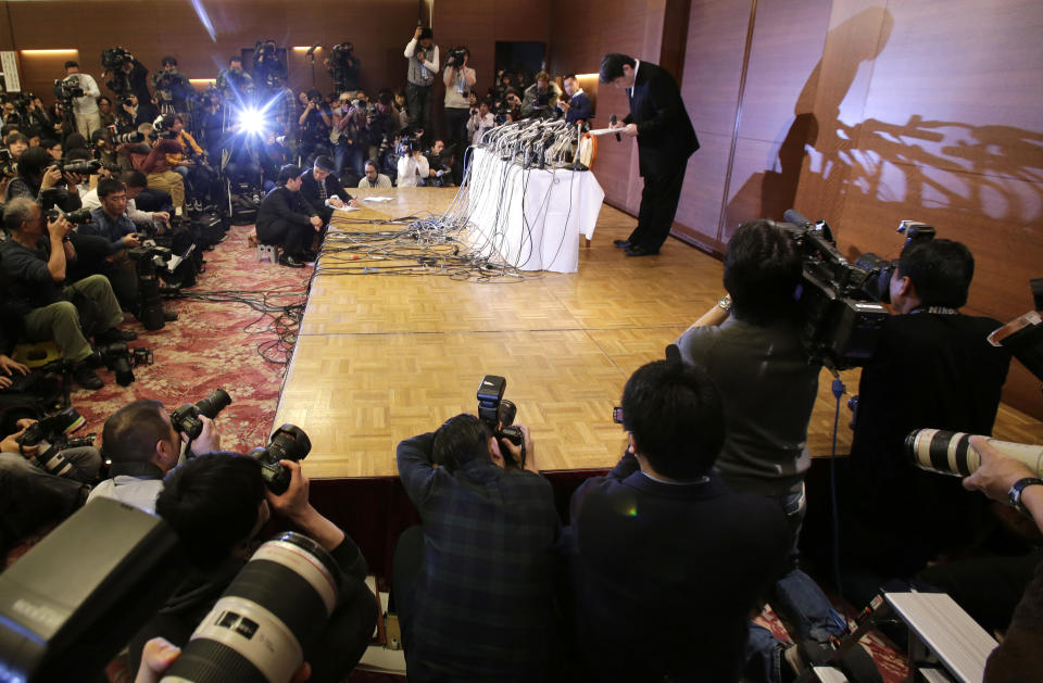 Mamoru Samuragochi bows during a press conference in Tokyo, Friday, March 7, 2014. The man once lauded as "Japan's Beethoven" bowed repeatedly and apologized Friday at his first media appearance since it was revealed last month that his famed musical compositions were ghostwritten and he wasn't completely deaf. (AP Photo/Shuji Kajiyama)