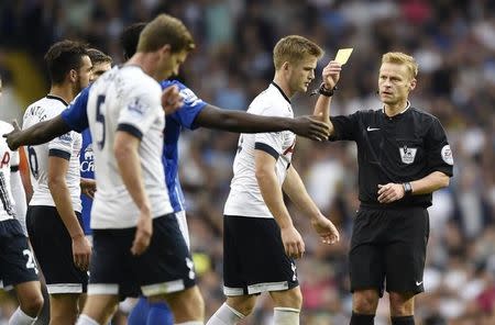 Football - Tottenham Hotspur v Everton - Barclays Premier League - White Hart Lane - 29/8/15 Tottenham's Eric Dier is shown a yellow card by referee Mike Jones Reuters / Toby Melville Livepic