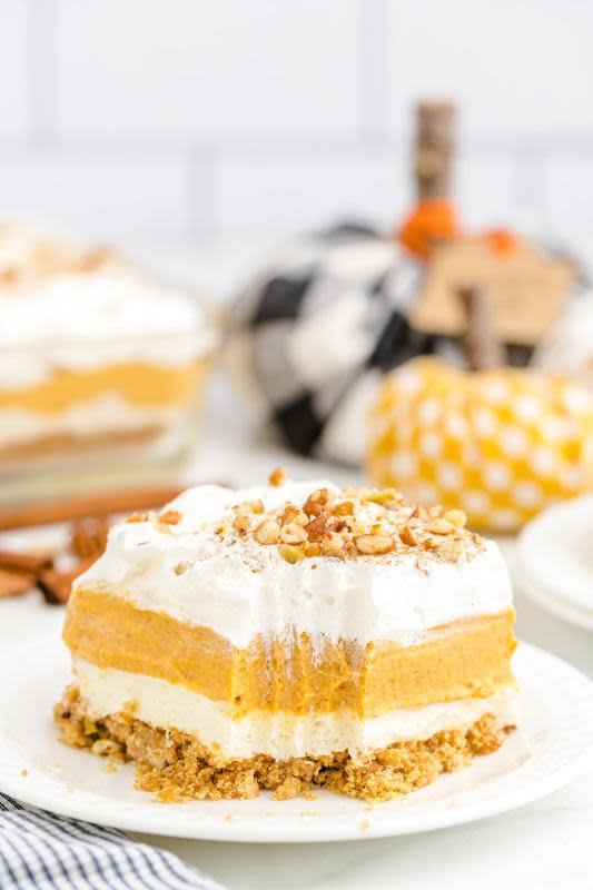 <p>Princess Pinky Girl</p><p>Pumpkin delight dessert with a buttery pecan and graham cracker crust, pumpkin spice, pumpkin puree and fluffy and light vanilla pudding. It is sure to become a favorite fall dessert. </p><p><strong>Get the recipe: <em><a href="https://princesspinkygirl.com/pumpkin-delight-dessert/" rel="nofollow noopener" target="_blank" data-ylk="slk:Pumpkin Delight Dessert;elm:context_link;itc:0;sec:content-canvas" class="link rapid-noclick-resp">Pumpkin Delight Dessert</a></em></strong></p>