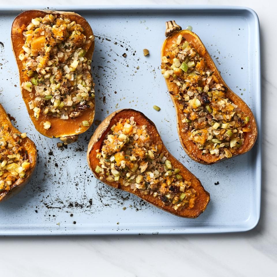 <p>Let this cute little vegetarian stuffed squash side dish steal the show at the dinner table! Butternut squash is stuffed with a sweet and savory filling that gets a crispy finish under the broiler. If you can't find small butternut squash, honeynut squash is a great alternative. Shaped much like a butternut squash (but smaller), the honeynut squash has a deep orange skin and sweet flesh.</p>