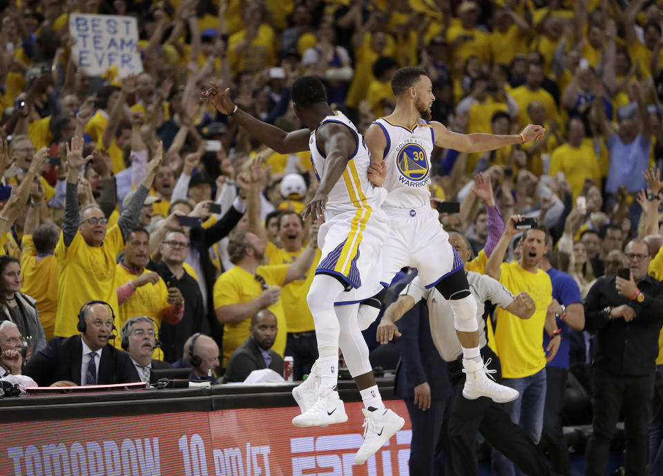 Draymond Green (L) and Steph Curry of the Golden State Warriors celebrate during Game 5 of the 2017 NBA Finals (AP)