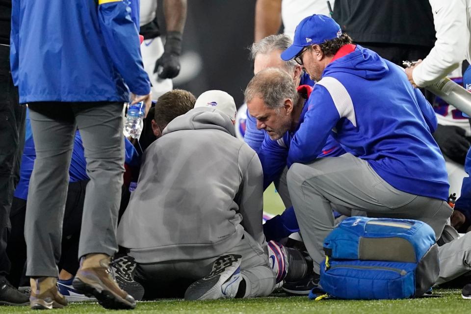 Buffalo Bills' Damar Hamlin is examined during the first half of Monday night's football game against the Bengals in Cincinnati. The game has been postponed after Buffalo Bills' Damar Hamlin collapsed, NFL Commissioner Roger Goodell announced.