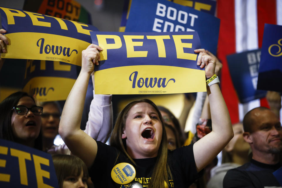 Attendees cheer as Democratic presidential candidate former South Bend, Ind., Mayor Pete Buttigieg speaks during a campaign event at Northwest Junior High, Sunday, Feb. 2, 2020, in Coralville, Iowa. (AP Photo/Matt Rourke)