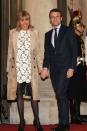 <p>In a cream floral embroidered dress with a camel coat and black pointed-toe heels while attending a state dinner with her husband in Paris, France.</p>