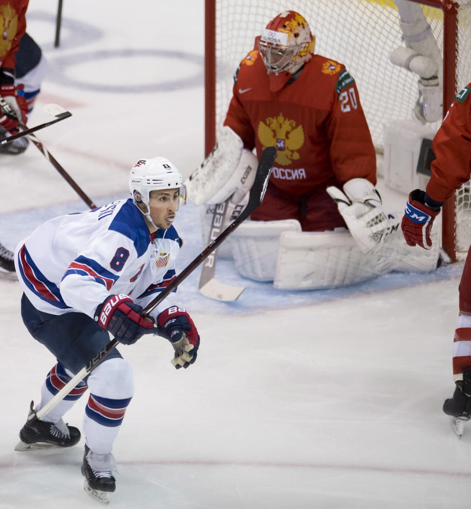 United States' Alexander Chmelevski (8) celebrates his goal past Russia goalie Pyotr Kochetkov during second-period IIHF world junior semifinal hockey action in Vancouver, British Columbia, Friday, Jan. 4, 2019. (Jonathan Hayward/The Canadian Press via AP)