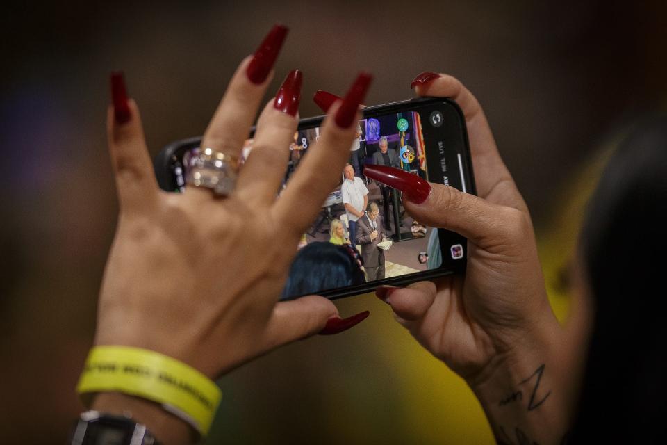 Supporters of former Brazilian President Jair Bolsonaro watch him speak at the Church of All Nations in Boca Raton, Fla., during his speaking engagement on February 11, 2023. 