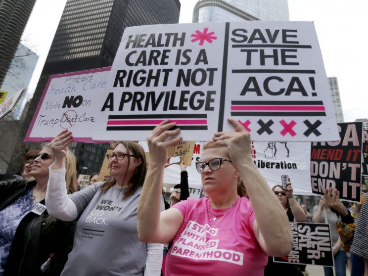 Protesters gather across the Chicago River from Trump Tower last Friday to rally against the repeal of the Affordable Care Act. 