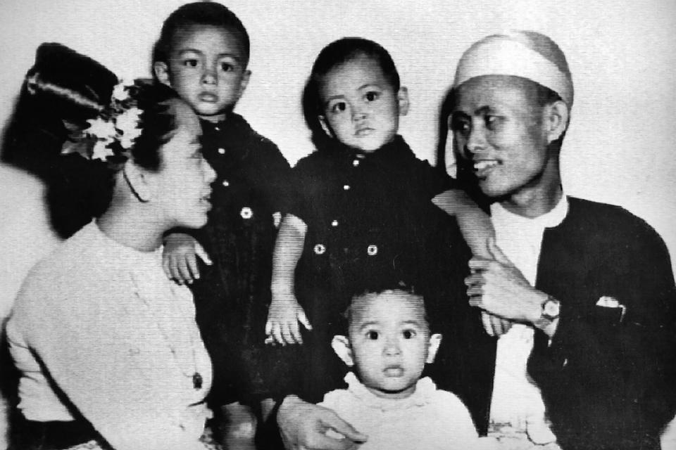 FILE - Two-year-old Aung San Suu Kyi, center, sits with her parents and two elder brothers in 1947. Myanmar court on Monday, Dec. 6, 2021, sentenced ousted leader Suu Kyi to 4 years for incitement and breaking virus restrictions, then later in the day state TV announced that the country's military leader reduced the sentence by two years. (Kyodo News via AP, File)