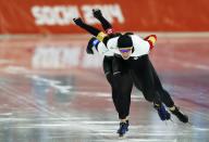 Canada's Christine Nesbitt (front-back), Kali Christ, and Brittany Schussler compete during their women's speed skating team pursuit quarter-finals event at the Adler Arena in the Sochi 2014 Winter Olympic Games February 21, 2014. REUTERS/Phil Noble (RUSSIA - Tags: OLYMPICS SPORT SPEED SKATING)