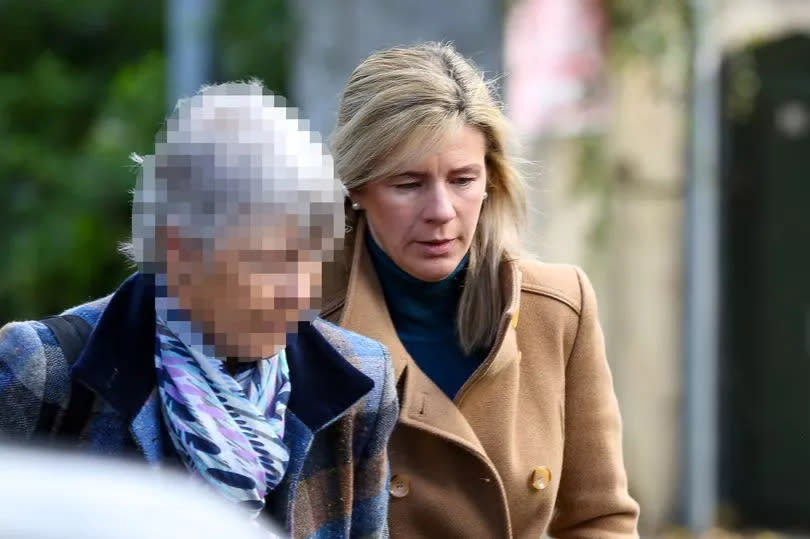 Jill Robinson ( right) appears at Derry Court in brown coat with shoulder length blond hair