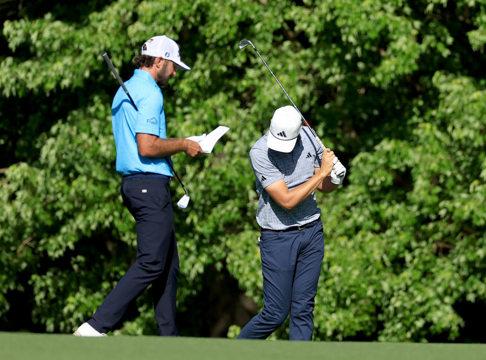 AUGUSTA, GA - APRIL 14: Ludwig Aberg of Sweden as playing partner Max Homa plays a shot during the final round of the 2024 Masters Tournament at Augusta National Golf Club Reacts after hitting his second shot into the water on the 11th hole while traveling to the United States on April 14, 2024 in Augusta, Georgia.  (Photo by David Cannon/Getty Images)