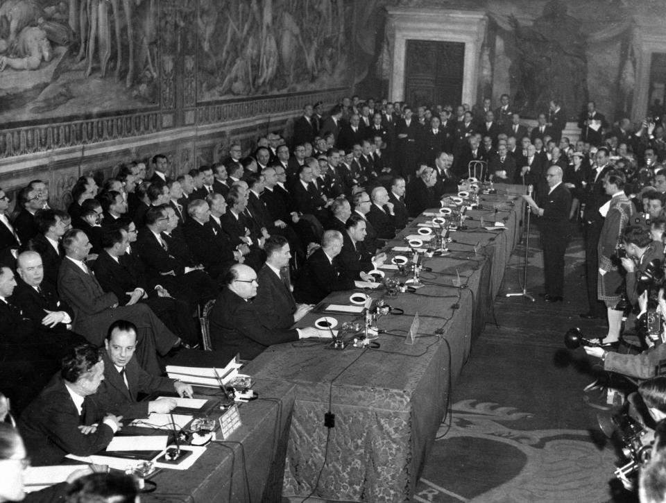 FILE - In this March 25, 1957 file photo, the delegates of six West European nations France, Germany, Italy, Belgium, The Netherlands and Luxembourg, gathered inside the Oriazi and Curiazi Hall of Rome's Campidoglio Capitoline Hill to sign a treaty establishing the European Economic Community (EEC). Britain was absent at the bloc's birth and only joined in 1973. On Jan. 31, 2020, Britain is scheduled to leave what became known as the European Union. (AP Photo, File)