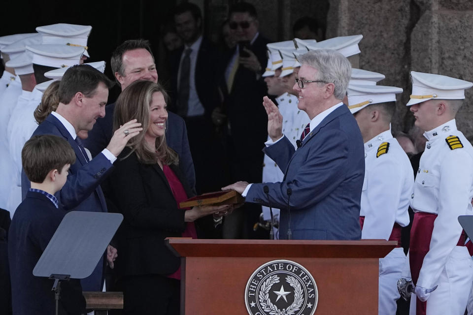 Texas Lt. Gov. Dan Patrick, right, is sworn in by District Court Judge Ryan Patrick, left, on the steps of the Texas Capitol in Austin, Texas, Tuesday, Jan. 17, 2023. (AP Photo/Eric Gay)