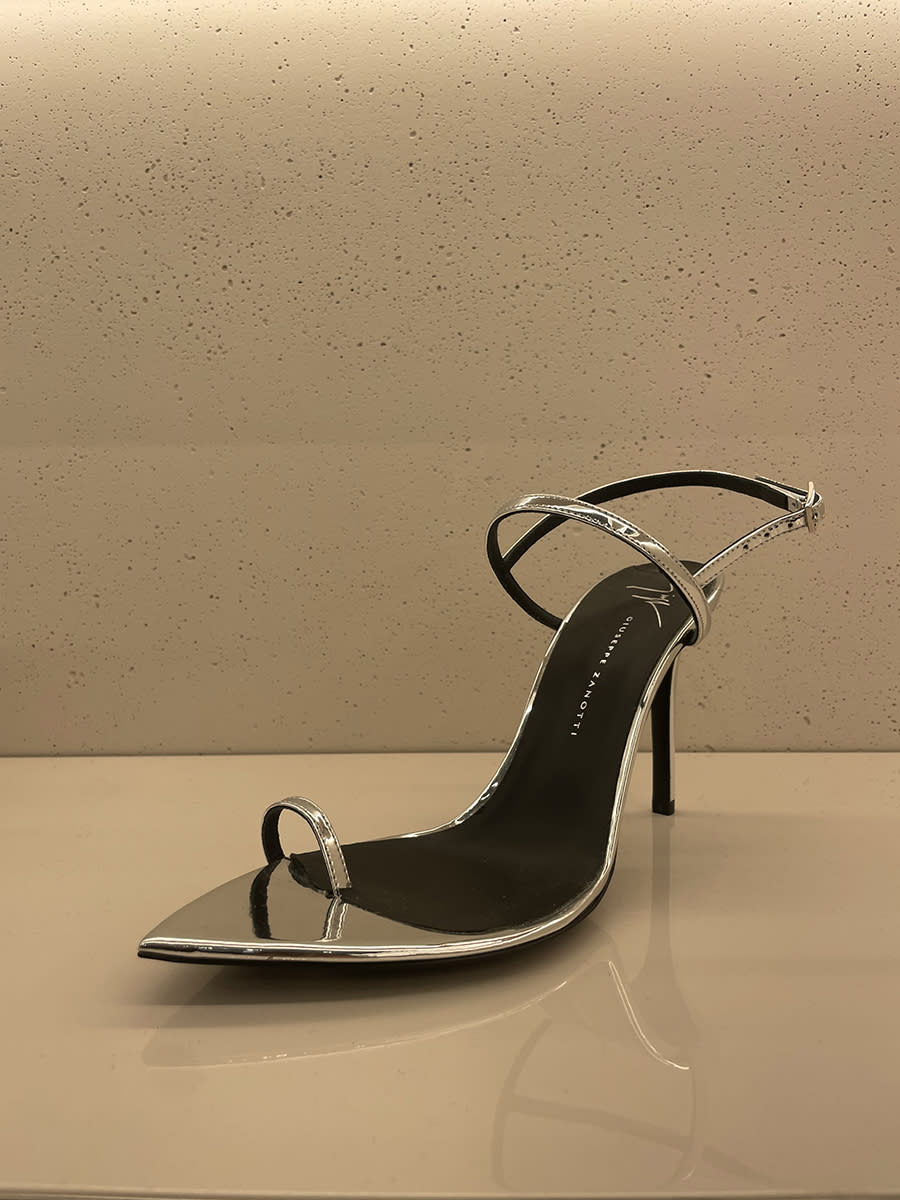 Giuseppe Zanotti’s big-toe heeled sandal in silver for spring ’24.