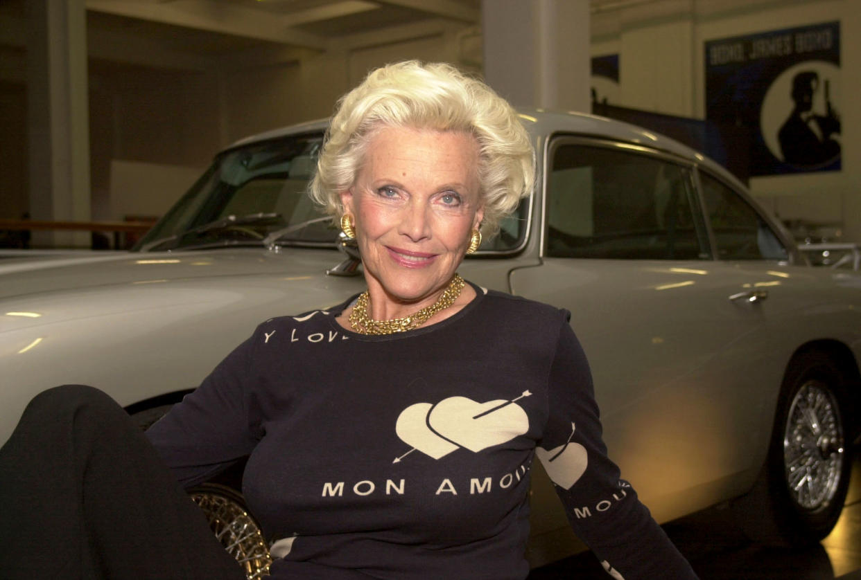 Former Bond-girl Honor Blackman, who played Pussy Galore in Goldfinger, with James Bond's Aston Martin DB5 during the opening of 'Bond, James Bond' at the Science Museum in London.    *...The exhibition claims to be biggest James Bond exhibition ever staged and features a huge collection of original objects, images, concept drawings, storyboards and costume designs.  21/12/03: Honor Blackman, who, it was revealed, declined a CBE in the Queen's birthday honours of 2002. The actress was one of 300 top stars who were today named in a secret list of celebrities who have turned down the honours system.   (Photo by Yui Mok - PA Images/PA Images via Getty Images)