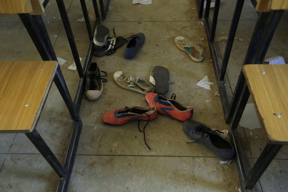 Shoes of the kidnapped students from Government Science Secondary School are seen inside their class room Kankara, Nigeria, Wednesday, Dec. 16, 2020. Rebels from the Boko Haram extremist group claimed responsibility Tuesday for abducting hundreds of boys from a school in Nigeria's northern Katsina State last week in one of the largest such attacks in years, raising fears of a growing wave of violence in the region. (AP Photo/Sunday Alamba)