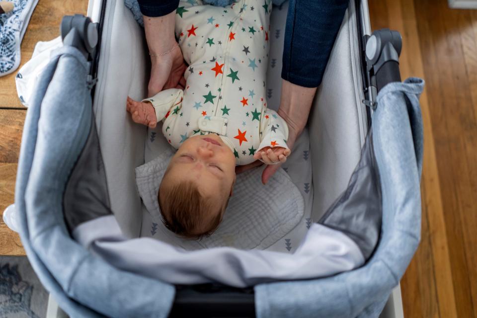 Corinne Rockoff, of Ferndale, lifts her son Sawyer Basin while waking him up at their home in Ferndale on Jan. 27, 2023.