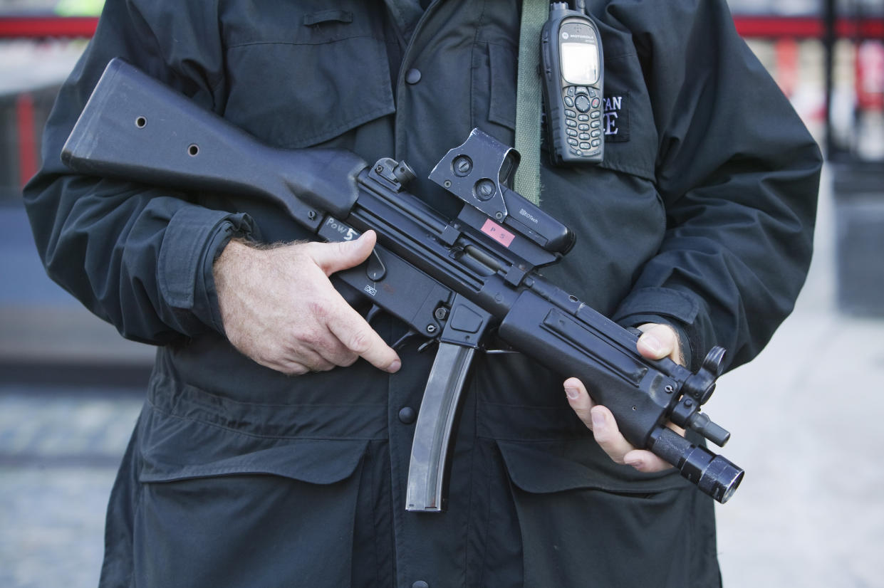 An armed policeman outside the house of Commons, London.