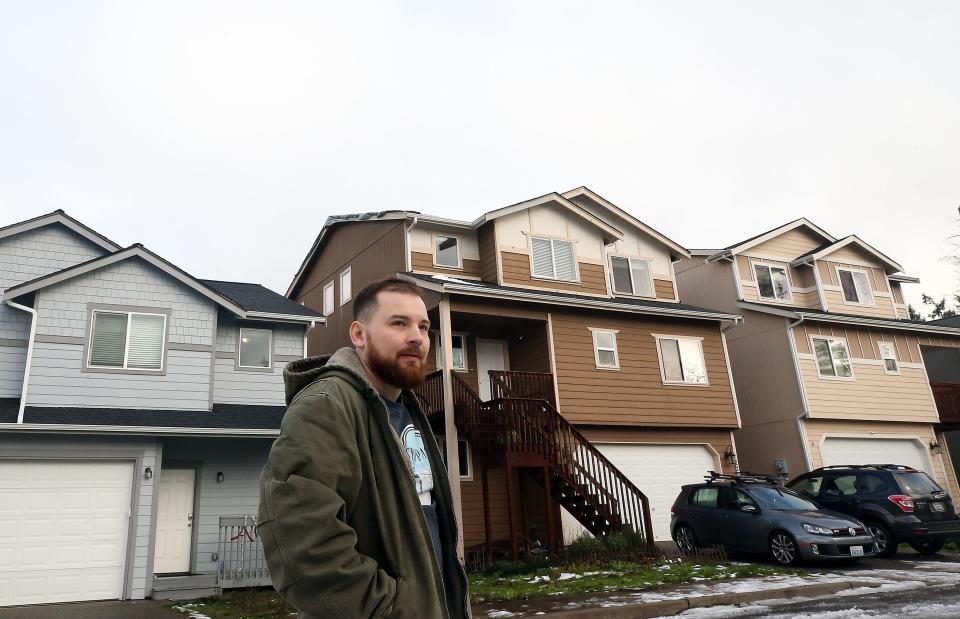 Troy Violette in front of his home (center) on Upchurch Way in Port Orchard on Jan. 4. The former Navy officer said he's still dealing with the fallout of damage done to his home in the December 2018 tornado, which hit while he was out to sea.