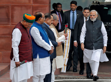 India's Prime Minister Narendra Modi walks to speak with the media after arriving at the Parliament on the first day of the winter session in New Delhi, India, December 11, 2018. REUTERS/Adnan Abidi/Files