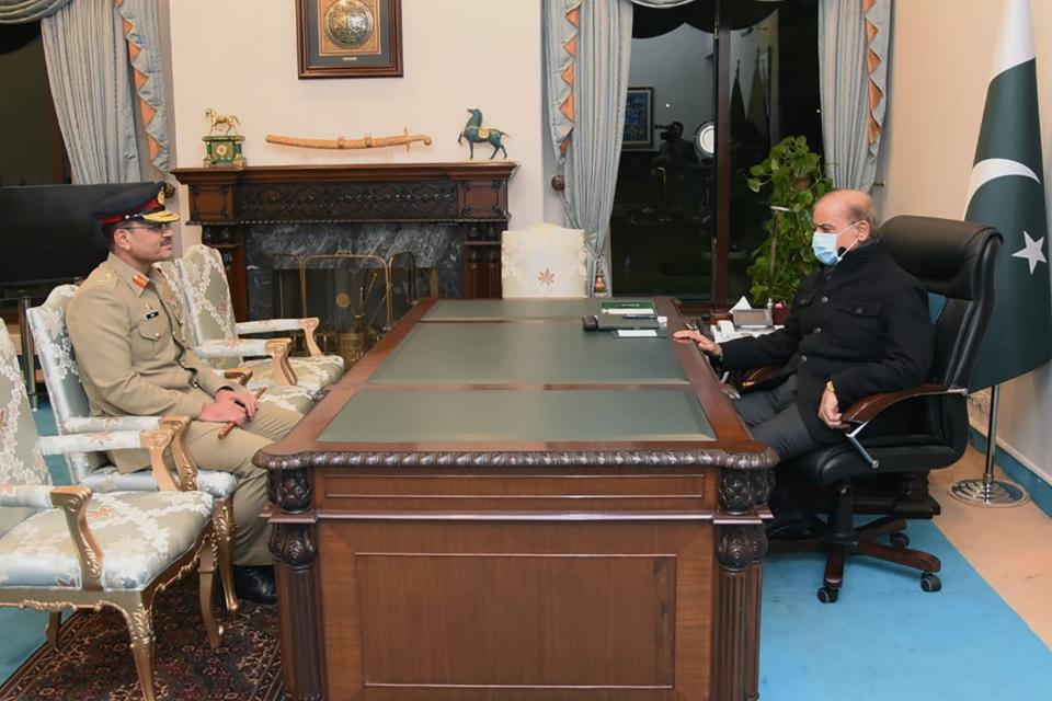 In this photo released by Pakistan's Prime Minister office, newly appointed Army Chief, Gen. Syed Asim Munir, left, meets with Prime Minister Shahbaz Sharif, in Islamabad, Pakistan, Thursday, Nov. 24, 2022. Pakistani Prime Minister has named Munir, the country's former spy chief, as head of the military, the information minister said, ending months of speculation about the new appointment. Later on Thursday President Arif Alvi endorsed the appointment and congratulated Munir on his promotion to four-star general, according to a statement from the presidency. (Pakistan's Prime Minister Office via AP)